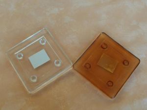 Kerzenteller eckig aus Glas in Orange